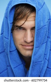 Portrait Of Young Man With Blue Towel On Head