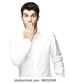 Portrait Of Young Man Covering His Mouth With Hand Over White