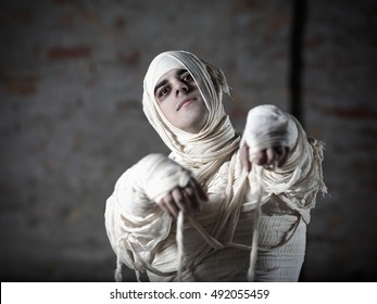 Portrait Of A Young Man Dressed In Halloween Costume Of Mummy. He Is Ready For Halloween Party.