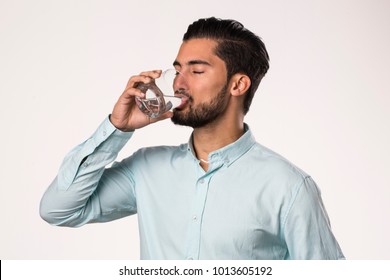 Portrait Of A Young Man Drinking A Water Glass