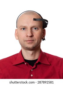 Portrait Of Young Man With EEG (electroencephalography) Headset On Head. Isolated On White Background.