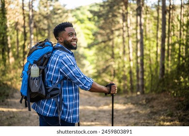 Portrait of a young man enjoys hiking in nature. - Powered by Shutterstock