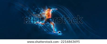 Portrait of young man, football player training isolated over dark blue background with polygonal and fluid neon elements. Action. Concept of sport, activity, creativity, energy. Copy space for art
