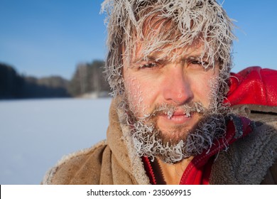 Portrait Of The Young Man With Frozen Icy Hairs On Head And Beard