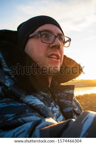 Similar – Entspannter Mann genießt die Natur an einem ruhigen See