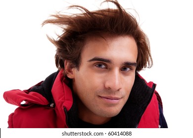 Portrait Of A Young Man With Hair On The Wind , In Autumn/winter Clothes, Isolated On White. Studio Shot