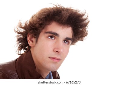 Portrait Of A Young Man With Hair On The Wind , In Autumn/winter Clothes, Isolated On White. Studio Shot