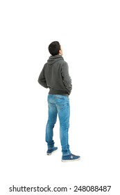 Portrait of the young man isolated on a white background, back view