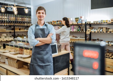 Portrait of young man owner over interior of Zero Waste Shop in Grocery Store. No plastic Conscious Minimalism Vegan Lifestyle Concept. - Powered by Shutterstock