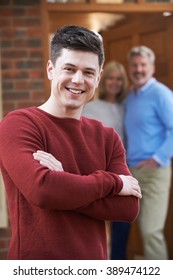 Portrait Of Young Man With Parents At Home