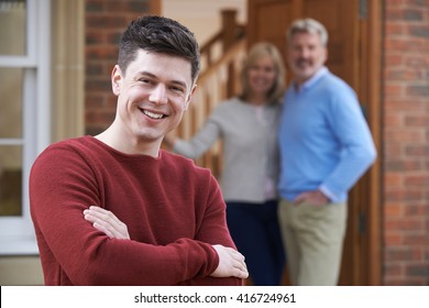 Portrait Of Young Man With Parents At Home