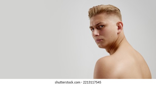 Portrait Of Young Man Posing Shirtless Isolated Over Grey Studio Background. Side View, Flyer. Concept Of Men's Health, Natural Beauty, Body And Skin Care, Male Cosmetology, Plastic Surgery