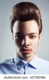 Portrait Of Young Man With Retro Classic Pompadour Hairstyle. Studio Shot. Looking At Camera.