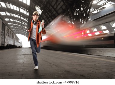 Portrait Of A Young Man Running In A Train Station