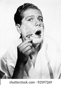 Portrait Of A Young Man Shaving