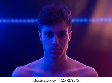 Portrait Young Man Shirtless Expresive With Red And Blue Light