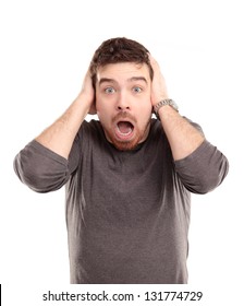 Portrait Of Young Man With Shocked Facial Expression, Isolated Over White Background