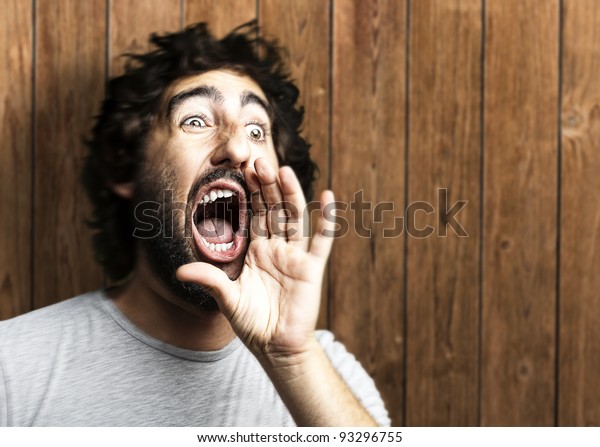 Portrait Young Man Shouting Against Wooden Stock Photo 93296755 ...