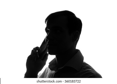 Portrait of a young man with a smart phone, tablet in hand - silhouette - Powered by Shutterstock