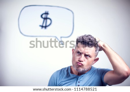 Portrait of a young man with a speech bubble dollar signe over his head