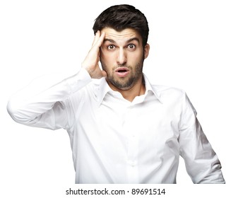 Portrait Of Young Man Surprised Against A White Background