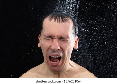 Portrait Of Young Man Taking Cold Shower In Bathroom