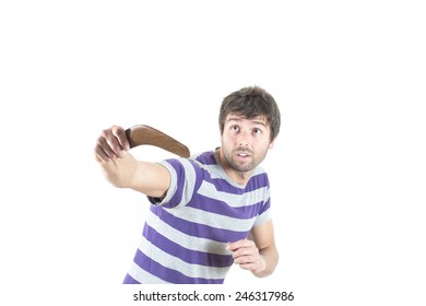 Portrait Of Young Man Throwing A Boomerang