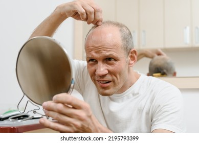 Portrait Of Young Man Unpleasantly Surprised By Self Haircut