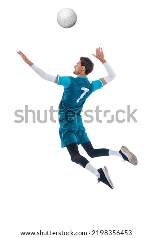 Portrait of young man, volleyball player in motion, training, playing isolated over white studio background. In a jump. Concept of sport, action, team game, active lifestyle, health, hobby, ad