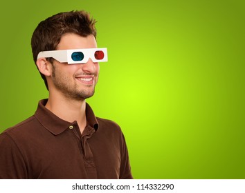 Portrait Of A Young Man Wearing 3d Glasses On A Green Background