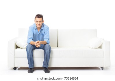 Portrait of the young man in white on sofa