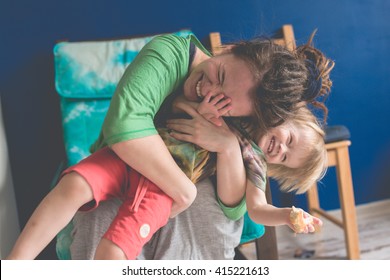 Portrait Of  Young Mother With Her Baby At Home, Living A Real Interior , Mom And Son Embrace, Toning