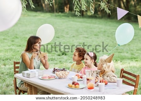 Similar – Image, Stock Photo Woman eating piece of cake in summer party