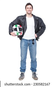 Portrait Of A Young Motorcyclist Is Holding A Helmet Posing Isolated On White Background.