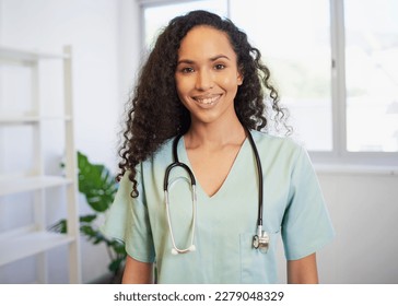 Portrait of a young multi-ethnic female doctor, in modern office - Powered by Shutterstock