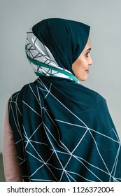 Portrait Of A Young Muslim Malay Woman In A Hijab (tudong, Head Scarf) Posing Against A White Background. 