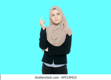 Portrait of a young Muslim woman thinks