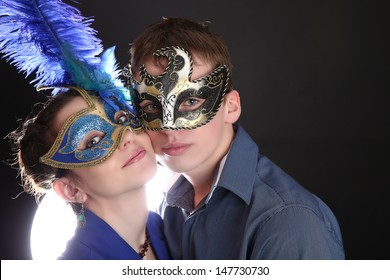 Portrait Of Young Mysterious Couple In A Venetian Mask