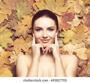 Portrait of young, natural and healthy woman over autumn background. Healthcare, spa, makeup and face lifting concept.