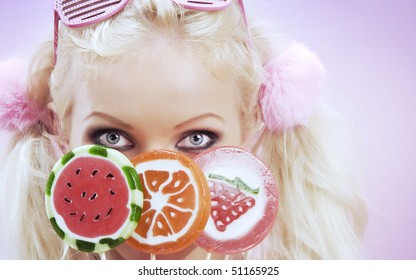 Portrait Of Young Nice Woman With Lollypop On Color  Back