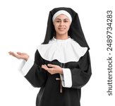 Portrait of young nun showing something on white background