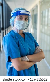 Portrait Of A Young Nurse In A Blue Uniform And A Protective Shield To Protect Against A New Dangerous Virus Covid19