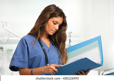 Portrait Of A Young Nurse In A Bright Hospital Room