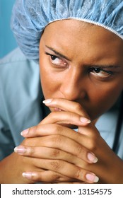 Portrait Of A Young Nurse Looking Unhappy And Tired