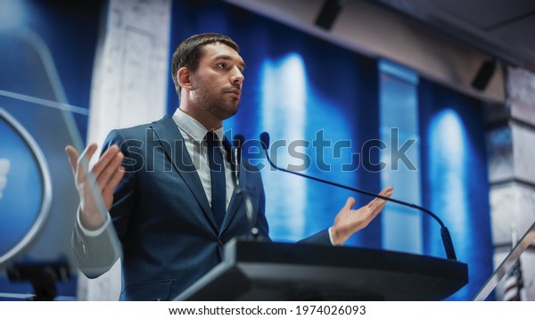Portrait of an Young Organization Representative\
Speaking at Press Conference in Government Building. Press Officer\
Delivering a Speech at Summit. Minister Speaking at Congress\
Hearing.