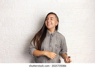 Portrait Of A Young Overweight Woman Dancing And Looking To The Side.