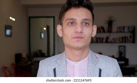 A Portrait Of A Young Pensive Indian Male Wearing A Trendy Jacket At Home