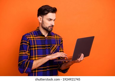 Portrait Of Young Person Look Use Laptop No Emotions Face Wear Checkered Outfit Isolated On Orange Color Background