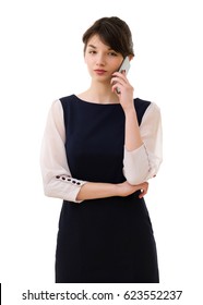 Portrait of young pretty business woman in white and blue suit phones isolated.