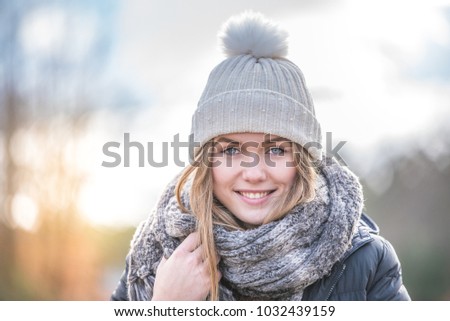portrait Young pretty woman on a road with snow in winter
